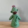 A felt Burdock Flower Fairy wearing a green dress and a pink flower in the hat with dark skin tone | © Conscious Craft